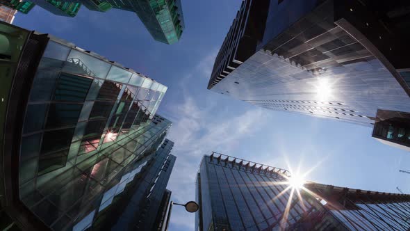 Timelapse of the sun passing between office buildings