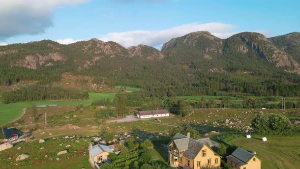 Traditional Norwegian Houses In Countryside In Ryfylke, Rogaland, Norway With Rocky Mountainous Land alt
