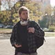 Man Using his Smartphone. Traveling Man with a Backpack Walking in the Big City - VideoHive Item for Sale