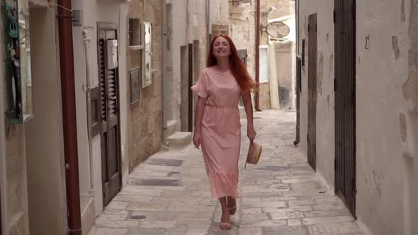 Happy Young Woman Tourist Walking Through Streets of Old European City Slow Motion alt