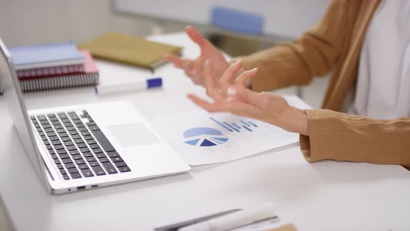 Unrecognizable Businesswoman Gesturing during Online Meeting alt