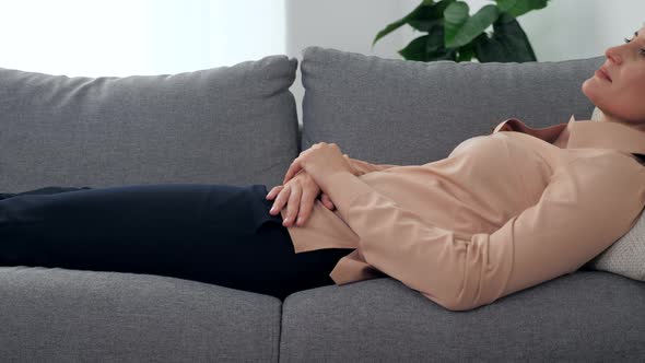 Adult Woman with Mental Health Problems Lying on Couch Listens Psychologist alt