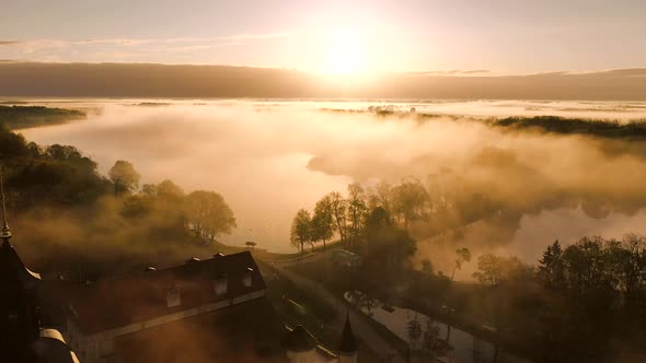 Amazing Dawn in the Foggy Nesvizh, Fog Over the River. Nesvizh. Ancient Castle . Belarus alt