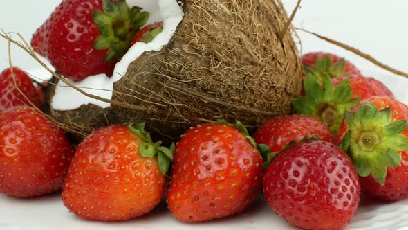 Close-up of a rotating coconut strawberry. Tropical Fruit Summer Juicy Berries Bali Vegetarian