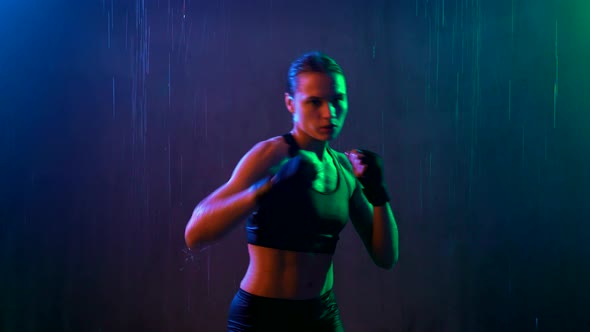 Wet Woman Doing Hit Boxing Workout alt