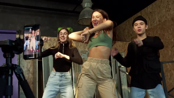 Mixed Race Group of School Kids Recording Trendy Dance on Smartphone alt