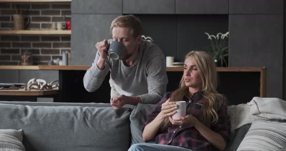 Casual Man and Woman Couple or Business Partners Drink Morning Hot Beverage Tea Coffee From Mug alt