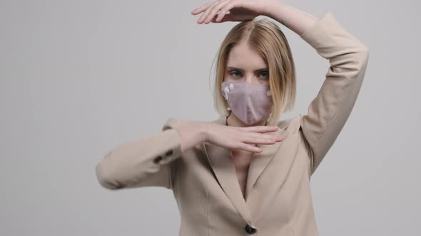 Portrait of Sensual Female Model in Stylish Face Mask alt