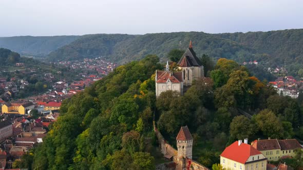 Aerial drone view of the Historic Centre of Sighisoara, Romania. Old buildings alt