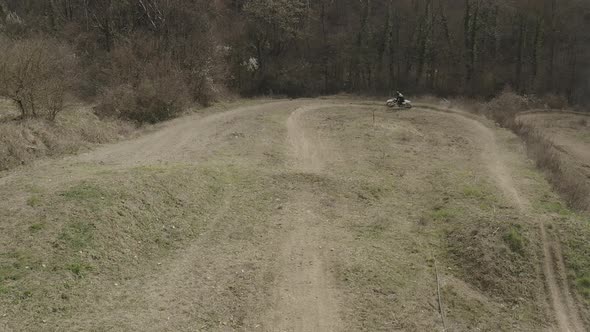 Motocross rider on a dirt track alt