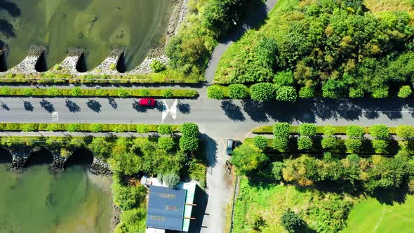Top-down view over the bridge passing Irish River  alt