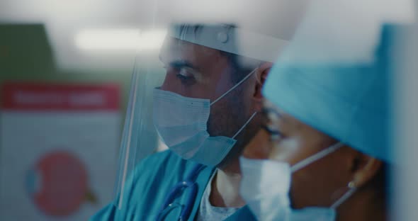 Diverse Doctors Discussing Test Results alt