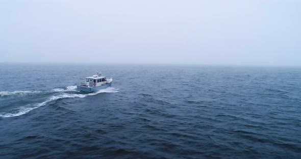 A boat traversing the cold waters Vinalhaven route of Maine alt