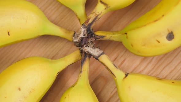 Bananas Forming A Circle On Cutting Board Spinning 01