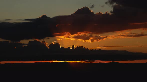 Amazing Sunrise Behind Storm Clouds Time Lapse alt