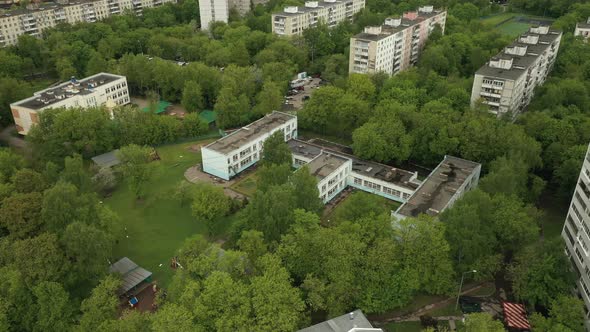 Kindergarten in the Midst of a Green Landscape Aerial View