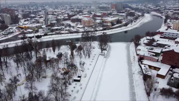 Skver Strilka park on winter river in Kharkiv city