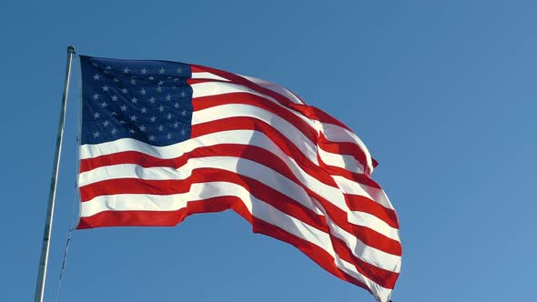 American USA Flag on a Flagpole Waving in the Wind