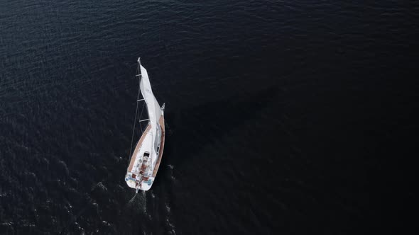 Aerial View of a Yacht Sailing on Open Sea at Windy Day