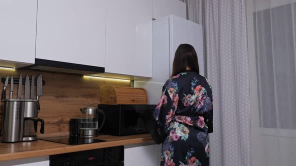 Pretty Woman Comes to Refrigerator to Take Cake in Secret alt