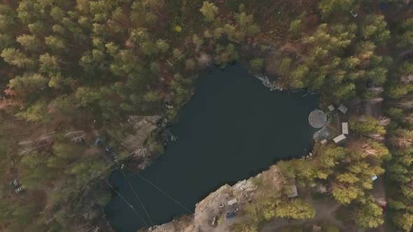 A Top View of a Lake in the Middle of the Forest alt