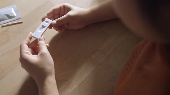 close up positive show result of covid negative show on nasal rapid self test kit at home alt