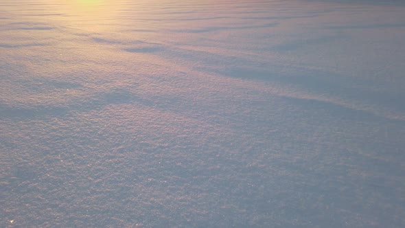 Endless Snowy Expanses at a Beautiful Sunset Over Horizon