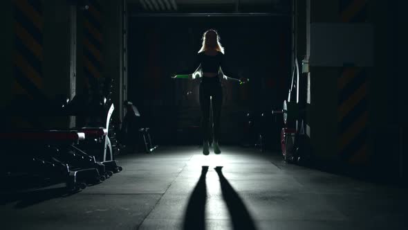 Girl Athlete Exercising on Jumping Rope in Gym Hard Working alt