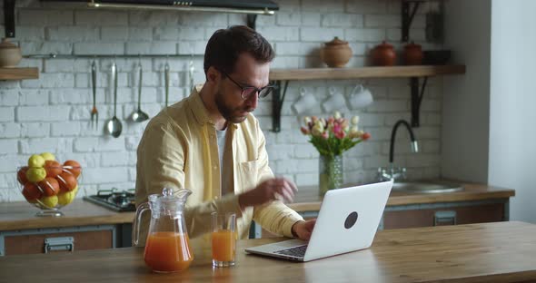Focused Business Man Getting Bad Results on Computer at Home Office alt