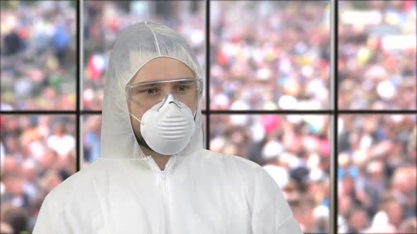 Portrait of a Guy Wearing White Respiratory Mask and Protective Suit alt