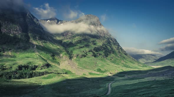 Beautiful dawn over the green mountains of Glencoe in Scotland, 4k, timelapse alt