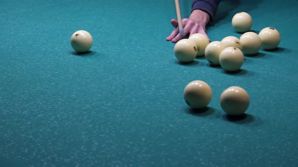 The player hits the balls. Game of billiards alt