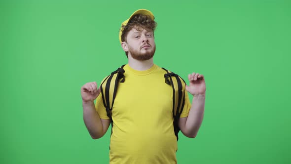 Portrait of Young Men Listening Attentively Pointing Finger at Viewer and Shows Thumbs Up Gesture alt