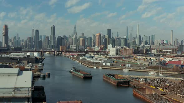 Aerial Descending Footage of Ship Pushing Barge on Newtown Creek alt