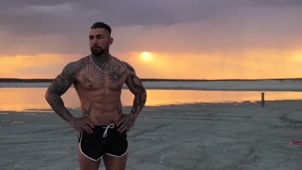 Masculine Man on Shore at Sunset