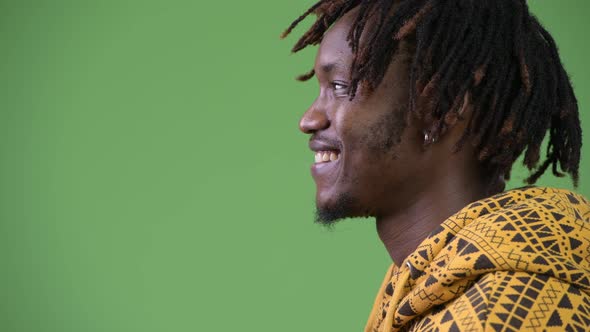 Profile View of Young Happy Handsome African Man Smiling alt