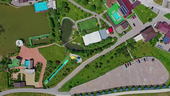 Recreation area with football pitch and swimming pool near the river alt