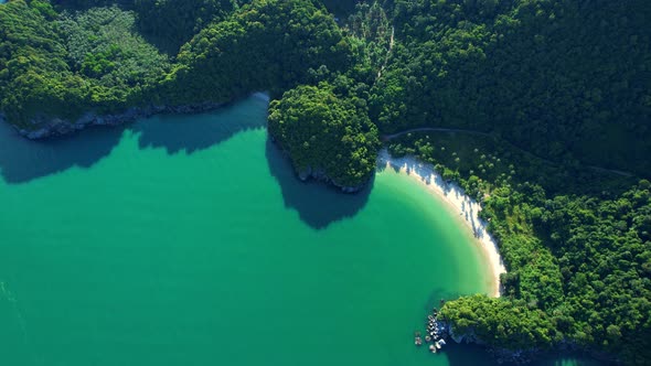 An aerial view of the unique turquoise waters and beautiful mountain coast alt