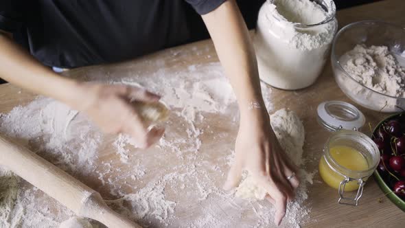 Skilled Cook Prepares Khinkali and Rolls Dough in Flour