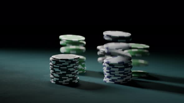 Casino chips or tokens forming stacks on a green gaming table. Winning. 4k alt