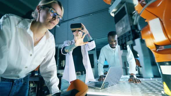Group of Scientists are Operating a Robot Through Virtual Reality alt
