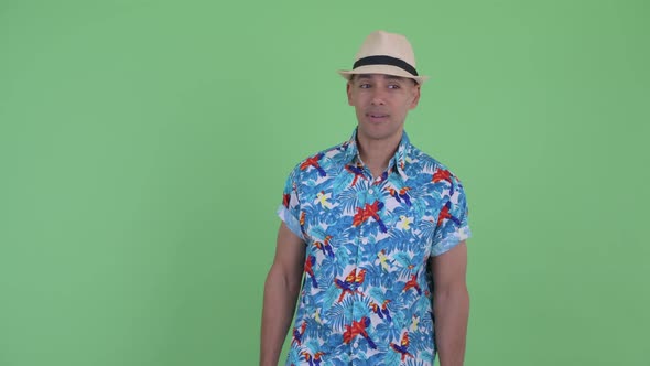 Happy Multi Ethnic Tourist Man Looking Around and Feeling Excited alt