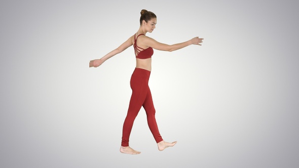 The blonde yoga instructor walking and waving her hands alt