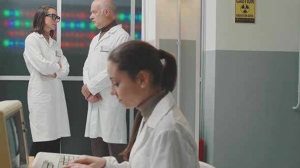 Scientific team discussing in the laboratory