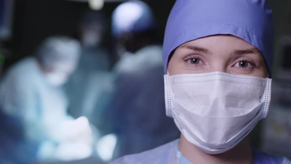 Young female doctor standing in operation room