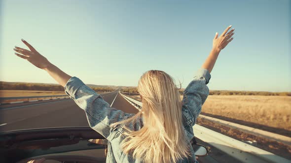 Woman With Hands Up Outstretched Stands In Front Seat Of Cabriolet View From Back By Uteam16