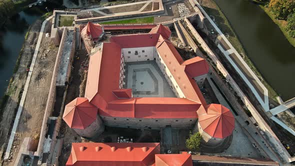 Aerial drone view of the Fagaras, Romania. Fagaras Citadel surrounded by a moat alt