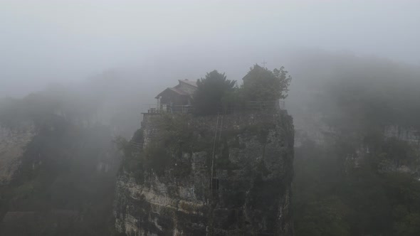 Aerial View of Katskhi Column in Morning Fog Massive Limestone Pillar alt