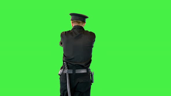 Caucasian Policeman Runs Gets the Gun Out and Aims on a Green Screen Chroma Key
