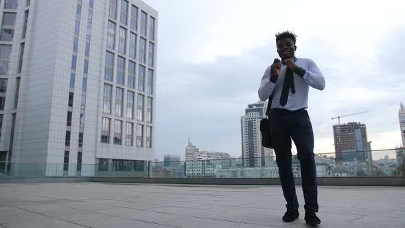 Serious Businessman Taking a Break and Dancing alt